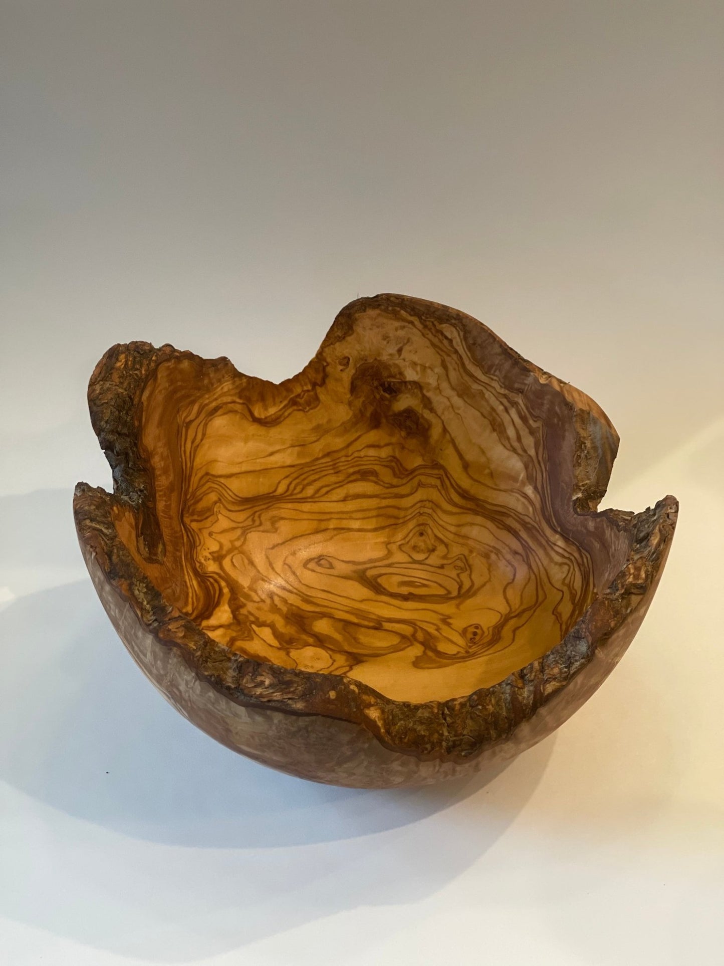 Olive wood salad bowl natural edge, white background