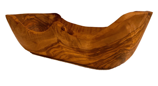 Hand-shaped live edge olive wood oblong bowl, natural irregular rim, unique grain, white background